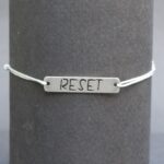 bracelet jade “Reset” médaillon inox